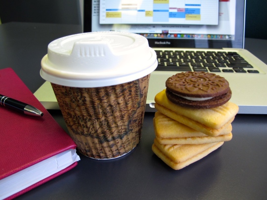 Picture of a takeaway coffee and Arnott's biscuits